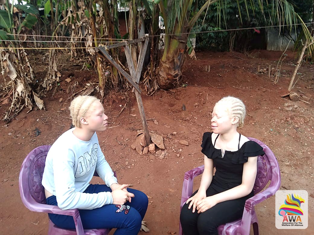 Two children with albinism supported by AWA in conversation, IAAD 2026, Bamenda